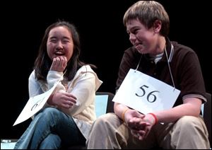 Blade spelling bee winner Heejae Chang, left, a sixth grader at Crim Elementary in Bowling Green, defeated Bowling Green Christian Academy eighth grader Matthew Scherreik by spelling 'daven' and 'Aesir.'