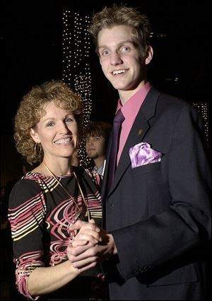 MOM'S PROM DATE: Becky Jarosz and son Brooks are a picture-perfect couple at the Mom Prom for St. John's Jesuit High School at SeaGate Centre.