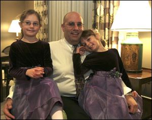 DADDY'S LITTLE GIRLS: Bob Michel, center, divides his attentions with daughters McKenzie, 6, left, and her sister, Allie, 4, for the Belmont Country Club's dads and daughters event.