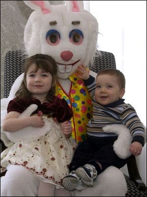 BREAKFAST WITH THE BUNNY: Amelia, 2, and Floyd Absher, 11 months, get the best seat at Stone Oak Country Club's Easter breakfast as they snuggle up to the Easter Bunny himself. The children are visiting their grandparents, Lanny and Mary Ann Laritz.