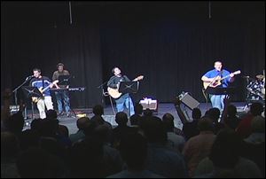Bands like this one in Bedford Township in 2004 are part of rallies held every spring and fall to bridge the gap between Promise Keepers gatherings for spirituality and male bonding. 