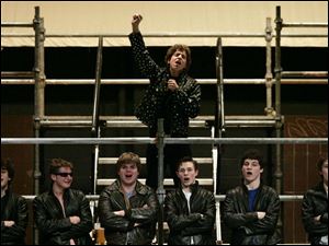 NBR grease24p 1 Nathan Levin, top, performs during a dress rehearsal of Ottawa Hills High School's production of "Grease" Thursday, 03/24/05, in Toledo, O. The Blade/Jeremy Wadsworth
