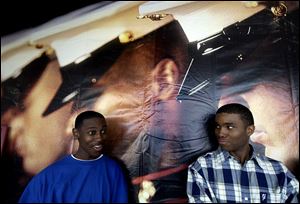 Wesley Kincaid, left, and Tony Frais reunite at the South Reynolds Road Marine Corps office where they enlisted.