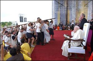 Pope John Paul II watches youths at World Youth Day in Toronto in 2002.
