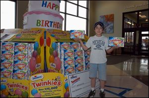 Donovin Cox, 11, of Tecumseh won a $40,000 college scholarship for his design of the 75th anniversary Twinkies boxes.