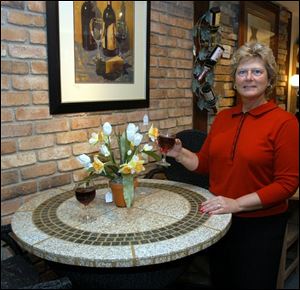 Lori Fletcher of Myers Hearth
& Casual with granite tabletop.