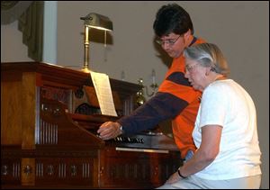 Reed organ restorer Casey Pratt, left, and composer Marcia Hendron at Fayette's popular Reed Organ Festival, May 2004.