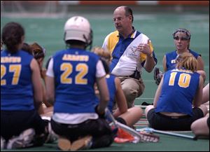 St. Ursula coach Paul Sieben talks to his team. The Arrows defeated Sylvania 9-4 in the Toledo Cup. There are 33 players in the St. Ursula program.