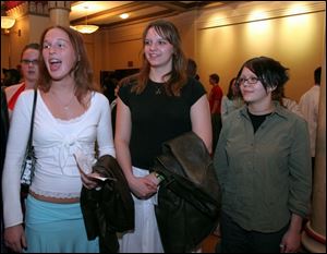 Findlay students Kelly Tesnow, left, Kelly Krucki, and Alexa Chester discuss their reaction to seeing <i>Faust</i>. 