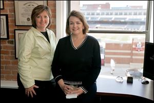 HENS-EYE VIEW: Kathie Kolody, left, and Sarah McHugh show off the view from their offices above 20 North Gallery.