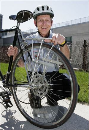 Larry Lindsay was in Toledo Thursday with his bike. He has gone across the United States twice.