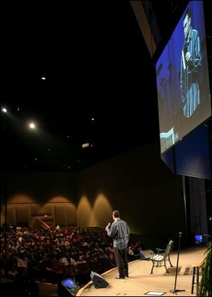 The Rev. Lee Powell preaches at CedarCreek Church, which draws over 7,000 people each weekend.