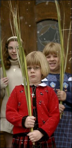 CTY palm24    Alexander Reder, center, stands with her palm at Holy Trinity Greek Orthodox Cathederal  on Sunday morning 4/24/05.  Behind her, l-r Stephanie MacVay and Anastasia Reder.  The Blade/Madalyn Ruggiero