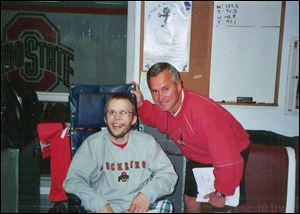 Neil Shuff, a cancer patient from Walbridge, poses with Ohio State football coach Jim Tressel. When Shuff visited an OSU practice last fall, Tressel asked him what the Buckeyes could do for him. Shuff said, 'Beat Michigan.' 