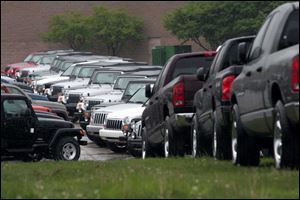 BIZ cars21p  Dodge Ram and Dodge Dakota pickups have joined other Chrysler vehicles, including Jeep Cherokees,  Jeep Wranglers, and Jeep Libertys, to  overflow the parking lots of the former North Towne Square in Toledo, Ohio on May 19, 2005. The Blade/Jetta Fraser