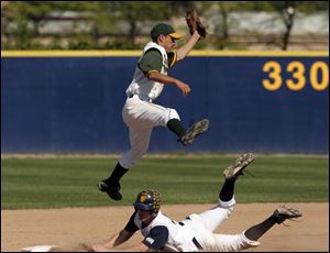 Whitmer's J.J. Fought steals second as Start's Ricardo Lizcano jumps for the throw.