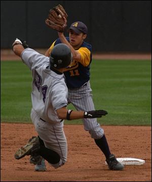 Archbold second baseman Patrick Shannon tags out Tom Andrews on an attempted steal. 