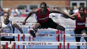 Rogers' Darryl Elston, center, was third last year in the 300 hurdles and returns to state as a favorite. He'll also run in the 110.