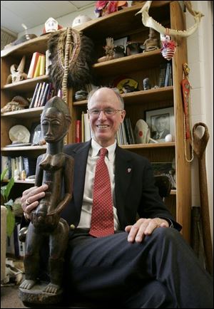 Phineas Anderson has been head of Maumee Valley Country Day School for 11 years. He has visited nearly 100 countries and keeps many of the artifacts he has collected in his office.