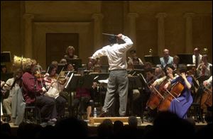 Conductor Stefan Sanderling leads the Toledo Symphony at the Peristyle. 