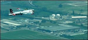 A restored B-17, Yankee Lady, approaches the Wood County Airport, where it will participate in an air show today. 