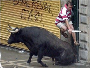 The weeklong festival in Pamplona, Spain, features daily runs with the bulls, which often entail close encounters with injury.