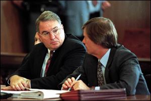 Paul Mifsud, left, the focus of a corruption inquiry when he was chief of staff for then-Gov. George Voinovich, consults with attorney William Meeks in 1997. Mr. Mifsud served six months in a jail work-release program and died from lung cancer in 2000.