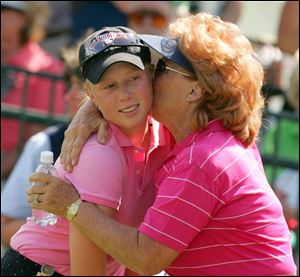 Morgan Pressel gets a kiss from her grandmother, Evelyn Krickstein, after tying for second at the U.S. Women's Open.