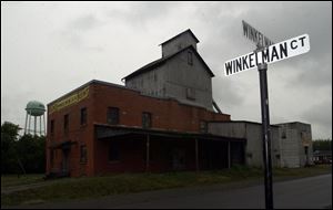 A street sign in Ottoville, at left, has been one of the few remaining traces of the Winkelman family, which once was prominent in the village. 