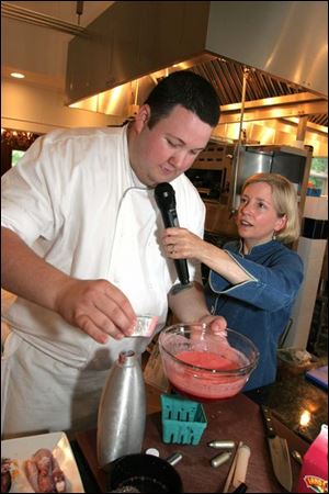 Emcee Sara Moulton interviews Chef Graham Elliot Bowles of the Peninsula Hotel's Avenue Restaurant in Chicago during the cook-off.