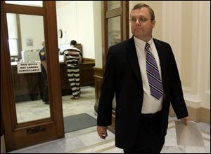 Putnam County Prosecutor Gary Lammers walks through the county courthouse.