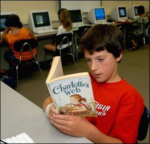 Trevor Brewer, 10, gets reading time at Glenwood School.