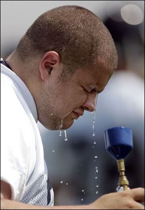 Offensive lineman Patrick Dawson was kept busy yesterday trying to cool off his 6-foot-3, 300-pound body at practice.