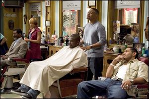 As Romadal (Dan White, right) goofs off, Calvin (Omar Gooding) and Terri (Toni Trucks) work on clients in the Showtime series Barbershop, premiering tomorrow night.