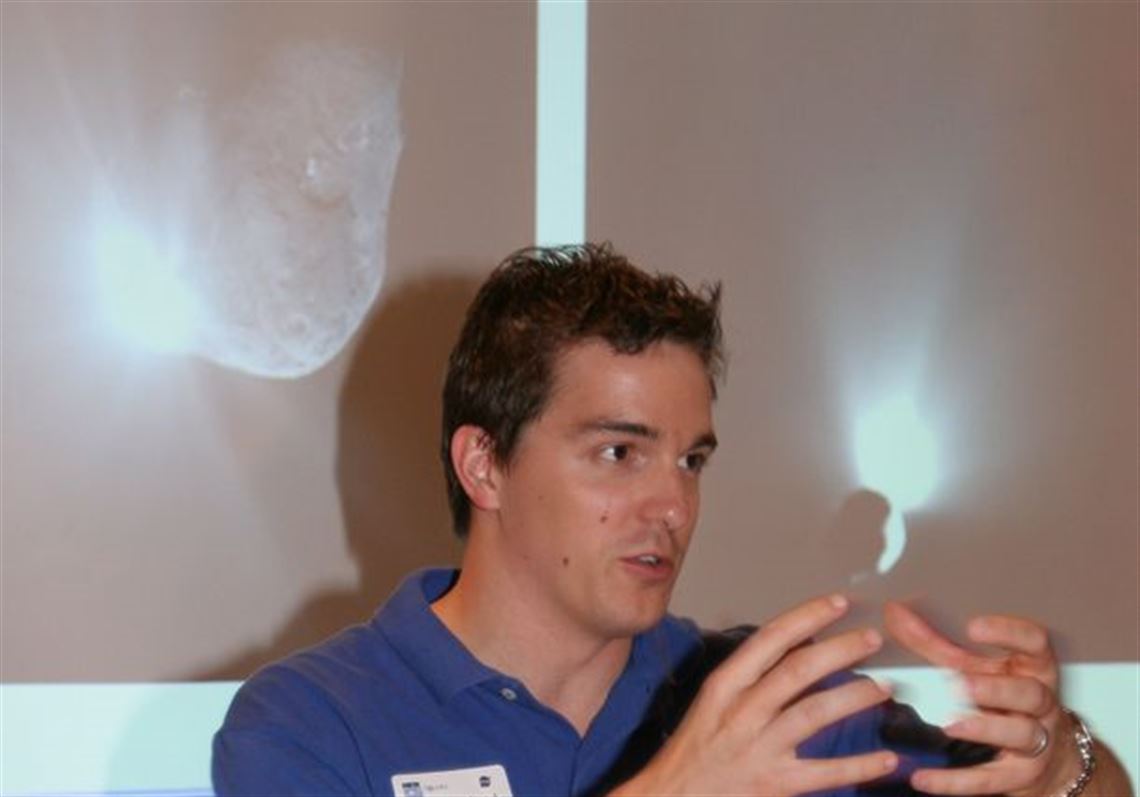 During a visit to COSI in Toledo, NASA scientist Steve Waydo explains the space agency's recent Deep Impact project, which was designed to help find out more about comets.