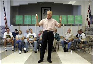 Carty Finkbeiner rallies his supporters at a meeting yesterday.