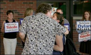 Matthew and Sheryl Frught embrace at Toledo Children's after their son arrived from Louisiana. 