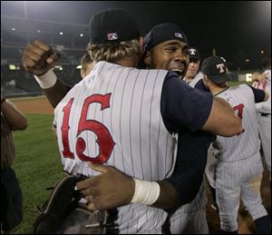 Mud Hens manager Larry Parrish and outfielder Marcus Thames celebrate Toledo s first Governors  Cup championship in 38 years following a 3-0 sweep of Indianapolis.Just a year ago, the Mud Hens had the worst record in the International League.
