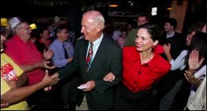 Carty Finkbeiner, at a post-primary party with his wife, Amy, plans to focus on achievements and economic development.
