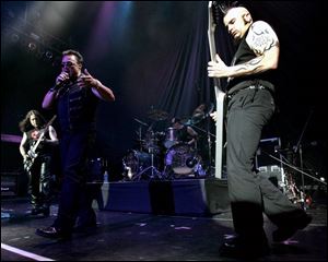 Heavy-metal band Queensryche, shown performing in June in Mansfi eld, Mass., plays in an 8
p.m. concert Sunday in the Stranahan Theater.