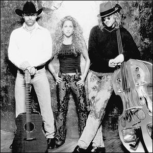 The country group Trick Pony, comprising, from left, Keith Burns, Heidi Newfield, and Ira Dean,
will appear Saturday night at the Hillsdale County Fair.