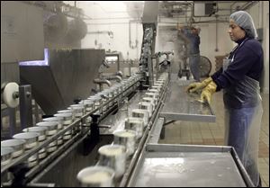 Annete Salinas works on the production line in the Fremont Co. s processing plant.

