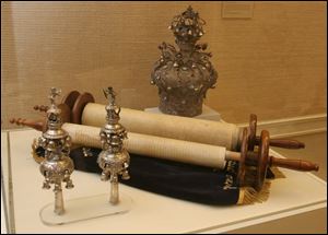 The Torah and crown are included in 'Judaica Toledo.'