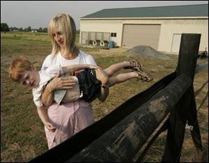 Cheryl Herr holds son Thomas, 3, at their Bowling Green home. The Herr twins, Thomas and Mary Grace, were born at 26 weeks and were aided by advances in medical technology.