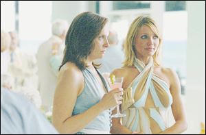 Toni Collette, left, and Cameron Diaz play feuding sisters in director Curtis Hanson s In Her Shoes.