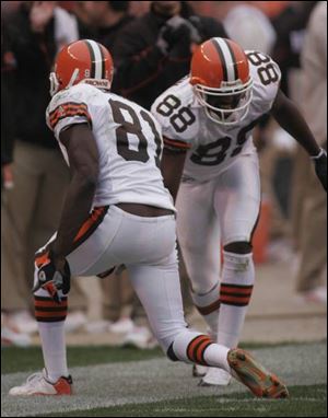 Browns' receiver Antonio Bryant, left, celebrates his second fourth-quarter score with teammate Frisman Jackson.