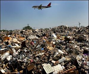 Debris from homes destroyed by Hurricane Katrina can contain a variety of toxic materials. The debris so far has remained in Louisiana, like this landfill in Kenner, near New Orleans.