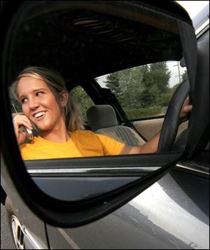 Lyndsey Shroyer, 17, a senior at Bedford High School, admits she uses her cell phone while driving if it's important.