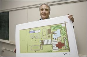 Hugh Caumartin, superintendent of Bowling Green schools,
holds up one of the proposals for the high school campus.
