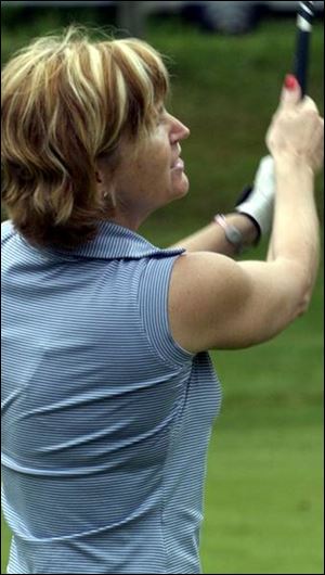 SWINGING: Gayle Eversole makes a swing and makes it count during the Babe Zaharias tournament at Brandywine Country Club.